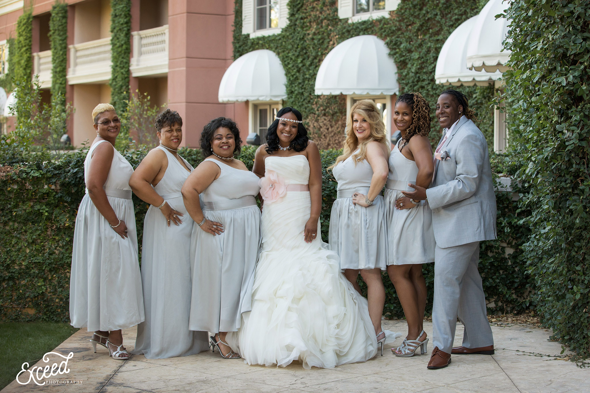 Bride with her bridesmaids on the day of her fall wedding at the Canyon Gate Country Club 
