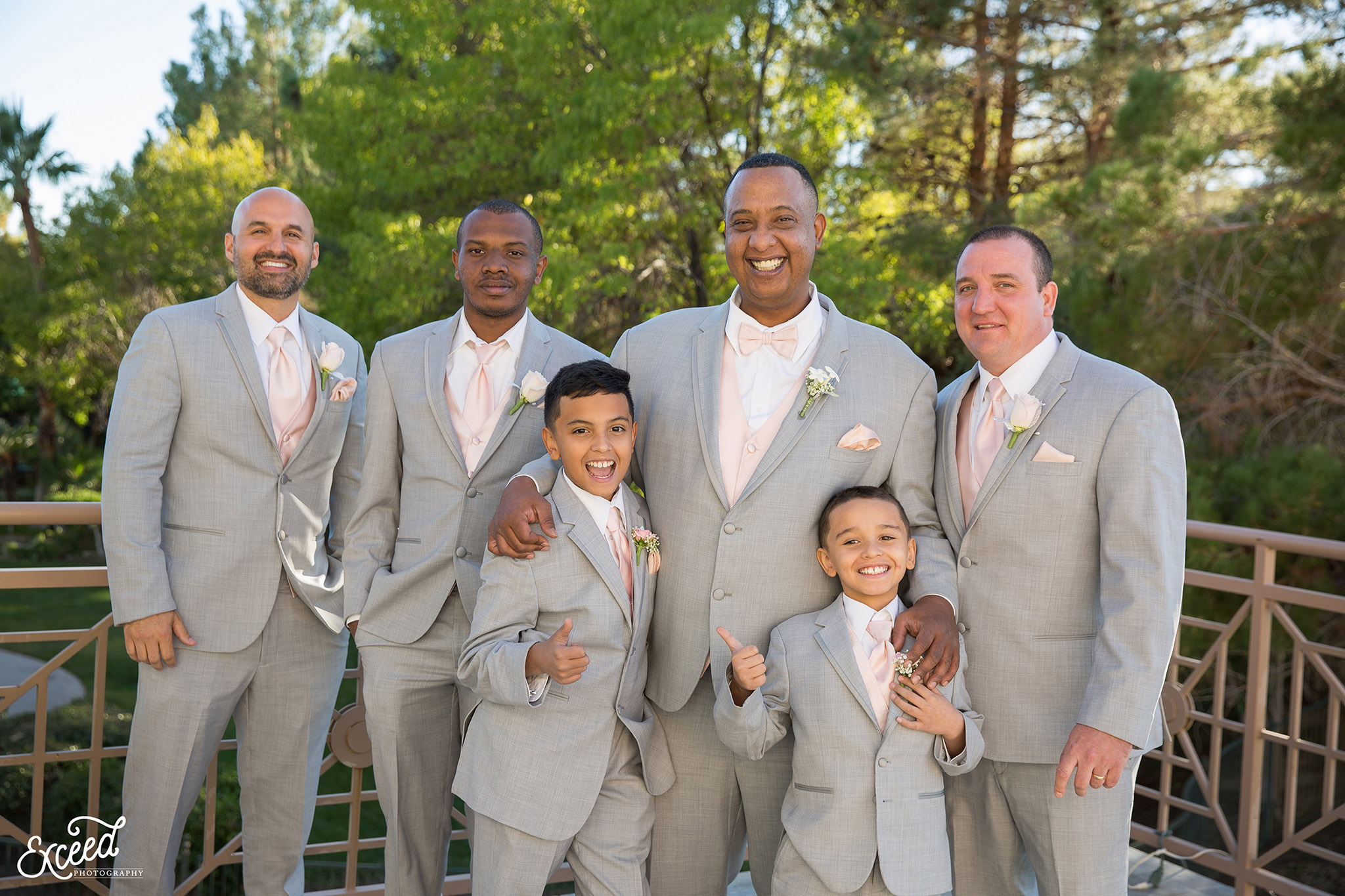 Portrait of the groom with his groomsmen at the Canyon Gate Country Club