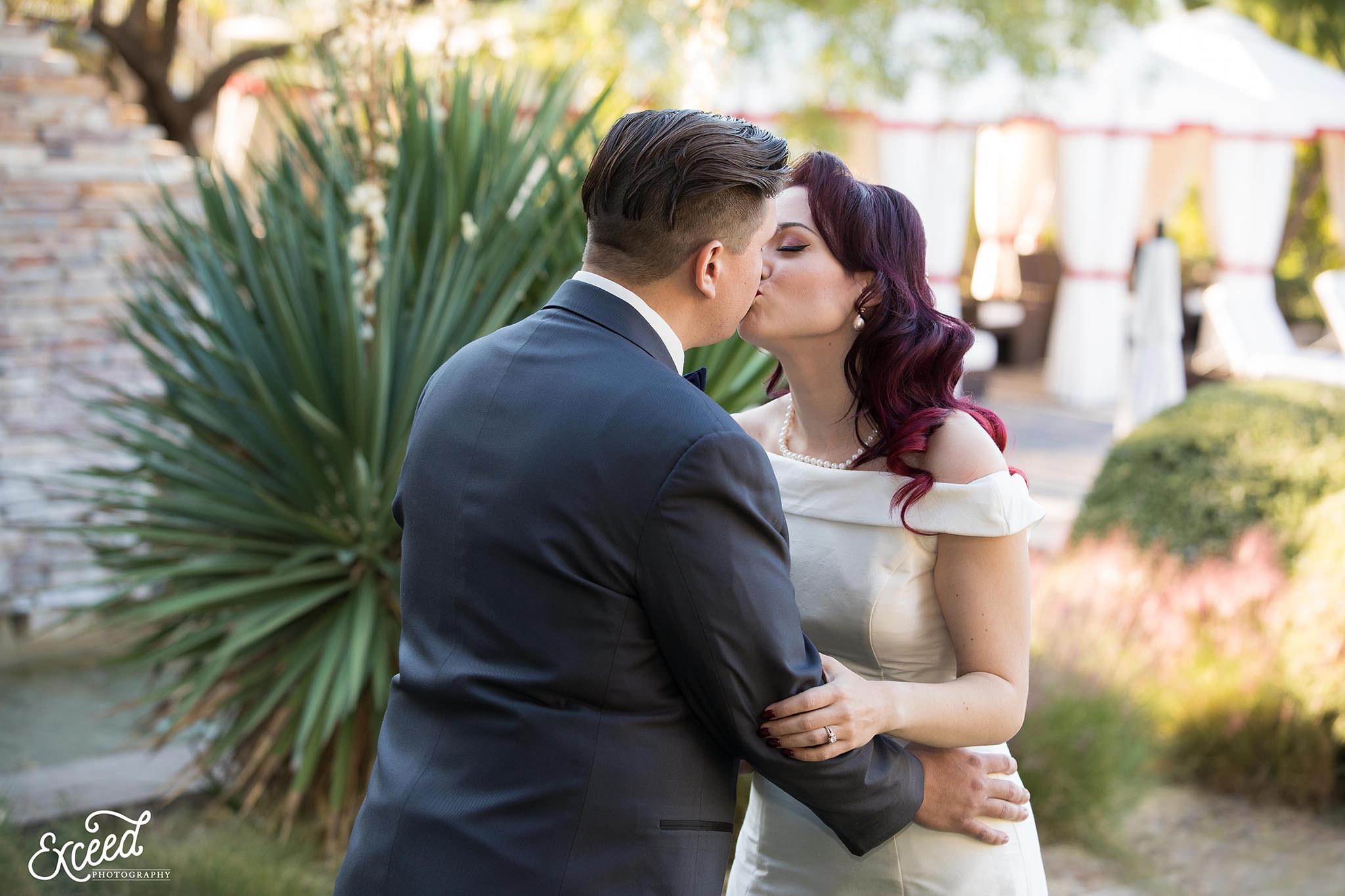 kiss at DragonRidge Country Club Wedding