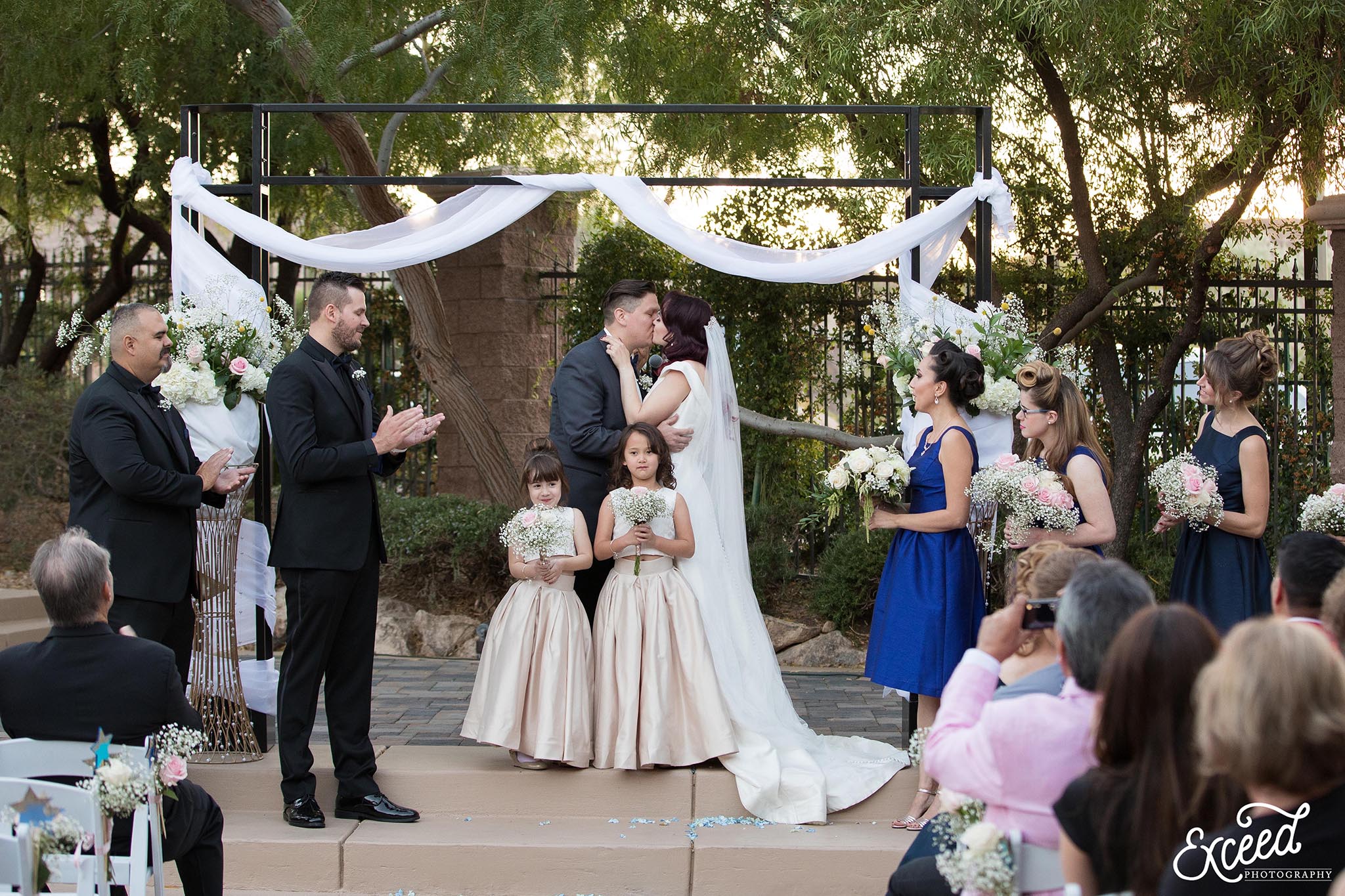 first kiss as husband and wife at DragonRidge Country Club Wedding